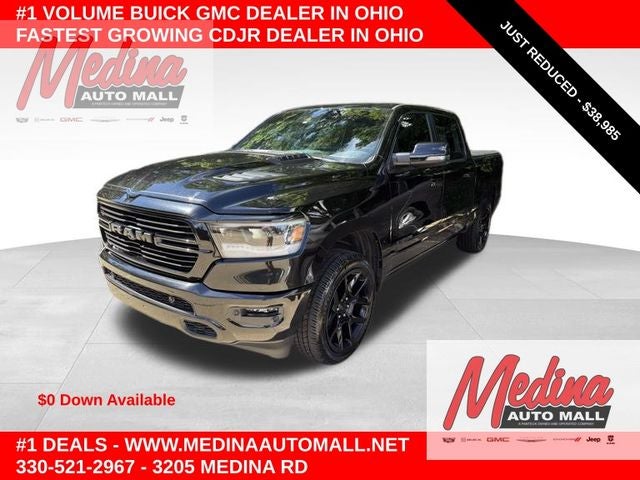 2023 RAM 1500 Laramie in Diamond Black Crystal Pearlcoat — front three-quarter view