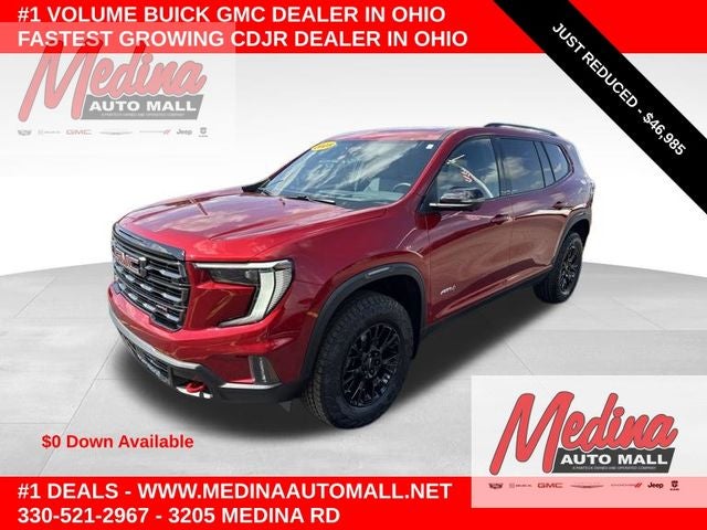 2025 GMC Acadia AT4 in Volcanic Red — front three-quarter view