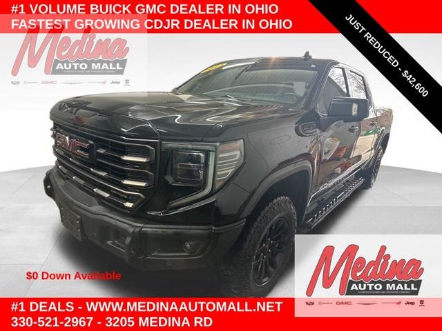 2023 GMC Sierra 1500 AT4X in Onyx Black — front three-quarter view