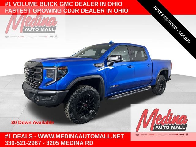 2023 GMC Sierra 1500 AT4X in Dynamic Blue Metallic — front three-quarter view