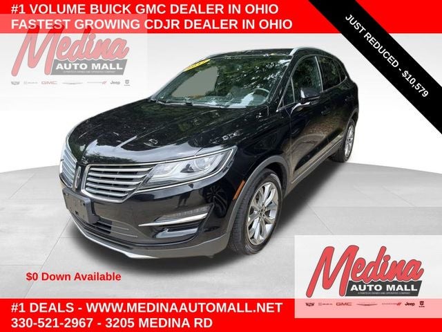 2017 Lincoln MKC Select in Ruby Red Metallic Tinted Clearcoat — front three-quarter view