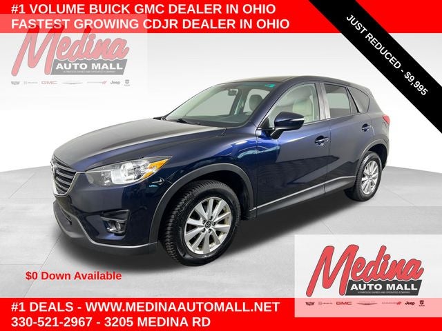 2016 Mazda Mazda CX-5 Touring in Deep Crystal Blue Mica — front three-quarter view